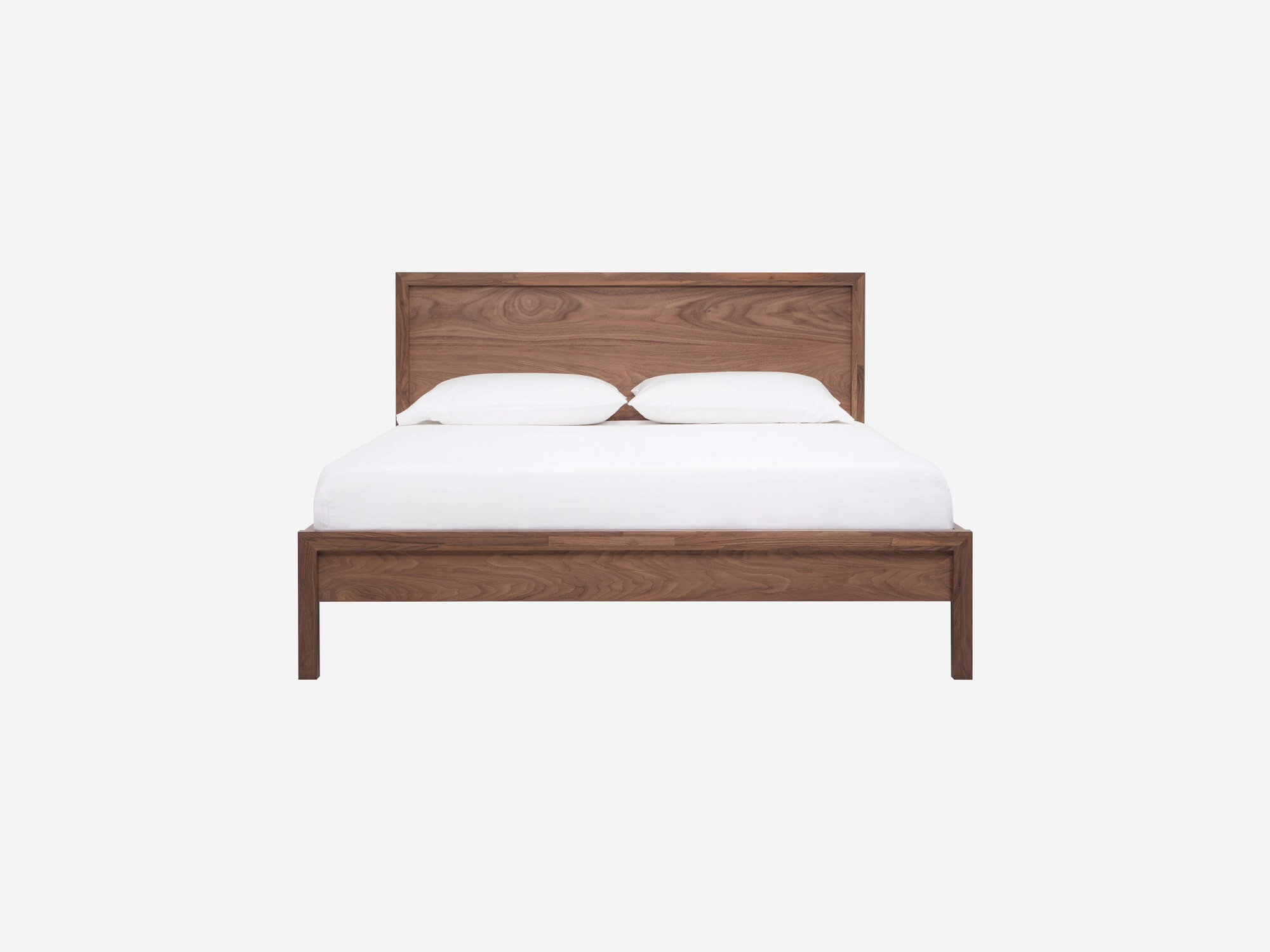 Front view of the EQ3 Marcel platform bed frame in walnut